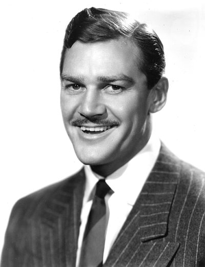 Douglas Fowley smiling with his fake teeth.